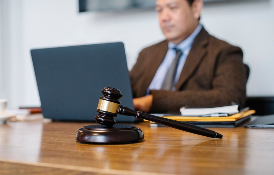 Solicitor reviewing Microsoft 365 security for law firms on a laptop at a tidy office desk