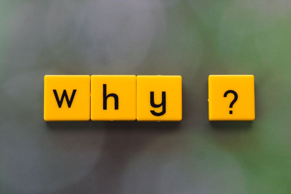 Translucent wet glass window covered with water drops with question mark on surface